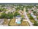 Aerial shot of the property showcasing its location in a serene, tree-lined neighborhood at 2558 Academy Ave, Deltona, FL 32738