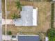 Aerial view of the property showcasing a large backyard and mature landscaping at 2558 Academy Ave, Deltona, FL 32738