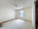 Bedroom featuring white walls, ceiling fan, window, and closet at 2558 Academy Ave, Deltona, FL 32738