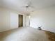 Bedroom with ceiling fan, closet, and doorway at 2558 Academy Ave, Deltona, FL 32738