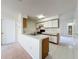 View of the kitchen, which opens to the living space at 2558 Academy Ave, Deltona, FL 32738