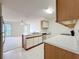 Practical kitchen overlooking a spacious living area, perfect for cooking and casual gatherings at 2558 Academy Ave, Deltona, FL 32738