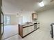 Functional kitchen open to a cozy living area, blending cooking and relaxation, ideal for everyday living at 2558 Academy Ave, Deltona, FL 32738