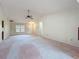 Cozy front living room that flows into the kitchen area, enhancing the home's inviting atmosphere at 2558 Academy Ave, Deltona, FL 32738