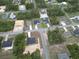 An aerial view showcasing a home nestled among lush greenery in a quiet neighborhood at 2644 Sw 162 Nd Street Rd, Ocala, FL 34473