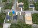 An aerial view showcasing a home on a corner lot surrounded by lush greenery at 2644 Sw 162 Nd Street Rd, Ocala, FL 34473