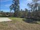 Large backyard surrounded by mature trees provides privacy and shade at 2644 Sw 162 Nd Street Rd, Ocala, FL 34473