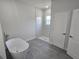Modern bathroom boasting a freestanding tub, glass-enclosed shower, and pristine white finishes at 2644 Sw 162 Nd Street Rd, Ocala, FL 34473