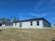 Exterior view of the home showcasing its clean lines and modern design against a blue sky backdrop at 2644 Sw 162 Nd Street Rd, Ocala, FL 34473