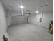 Spacious garage with concrete floors and a large door for convenient vehicle parking at 2644 Sw 162 Nd Street Rd, Ocala, FL 34473