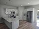Modern kitchen featuring stainless steel appliances, white cabinets, and center island at 2644 Sw 162 Nd Street Rd, Ocala, FL 34473