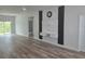 Inviting living room with wall mounted entertainment center and modern vinyl plank flooring at 2644 Sw 162 Nd Street Rd, Ocala, FL 34473