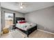 This bedroom features a modern ceiling fan and natural light from the window with custom window coverings at 2844 Eagle Lake Dr, Orlando, FL 32837
