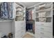 Walk-in closet featuring built-in shelving and drawers for optimal organization at 2844 Eagle Lake Dr, Orlando, FL 32837