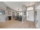 Welcoming dining area adjacent to entry showcasing natural light and wood-look floors at 2844 Eagle Lake Dr, Orlando, FL 32837