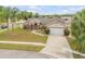 Inviting exterior view of a single-Gathering home with a well-maintained lawn and attached two-car garage at 2844 Eagle Lake Dr, Orlando, FL 32837