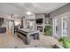 Open-concept game room with pool table, fireplace and kitchen access at 2844 Eagle Lake Dr, Orlando, FL 32837