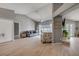 Open-concept living room featuring vaulted ceilings, hardwood floors, and access to the backyard pool area at 2844 Eagle Lake Dr, Orlando, FL 32837