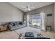 Cozy living room with hardwood floors, vaulted ceilings, and a view of the backyard pool area at 2844 Eagle Lake Dr, Orlando, FL 32837