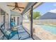 Inviting screened patio features seating, view of the swimming pool and spa at 2844 Eagle Lake Dr, Orlando, FL 32837
