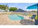 Private backyard oasis with sparkling pool, spa, seating area, and lush landscaping at 2844 Eagle Lake Dr, Orlando, FL 32837