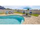 Backyard featuring a refreshing in-ground pool surrounded by lush landscaping at 2844 Eagle Lake Dr, Orlando, FL 32837