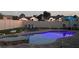 Backyard pool with spa and patio seating area at dusk at 2844 Eagle Lake Dr, Orlando, FL 32837