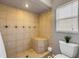 Tiled walk-in shower featuring built-in seating and decorative accents at 2844 Eagle Lake Dr, Orlando, FL 32837