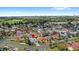 Aerial view showcasing the house within its neighborhood; golf course and EPCOT in the background at 3192 Running Deer Path, Kissimmee, FL 34746