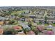 Overhead shot featuring the home nestled in the neighborhood and nearby pond at 3192 Running Deer Path, Kissimmee, FL 34746