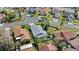 An aerial view of the property located in a neighborhood with a gray roof at 3192 Running Deer Path, Kissimmee, FL 34746
