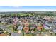 Overhead shot of the property surrounded by other homes, golf course, and green spaces at 3192 Running Deer Path, Kissimmee, FL 34746