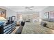 Bright bedroom with a plush king bed, work space, ceiling fan, and a stylish dresser at 3192 Running Deer Path, Kissimmee, FL 34746