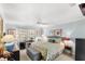 Cozy bedroom features soft blue walls, a king-sized bed, and a sunny workspace near the window at 3192 Running Deer Path, Kissimmee, FL 34746