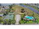 Community amenities include pool, tennis, volleyball, and a large lake in the background at 3192 Running Deer Path, Kissimmee, FL 34746