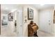 Bright hallway featuring tiled floors, neutral walls, and a view of a bedroom at 3192 Running Deer Path, Kissimmee, FL 34746