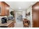 Cozy kitchen nook that provides easy access to outdoor seating through the sliding glass doors to screened porch at 3192 Running Deer Path, Kissimmee, FL 34746