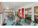 Relaxing screened porch featuring cozy seating, a ceiling fan, and colorful decor at 3192 Running Deer Path, Kissimmee, FL 34746