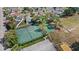 Overhead shot of community tennis and basketball courts next to a parking area at 3192 Running Deer Path, Kissimmee, FL 34746