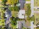 Bird's-eye view of a home with waterfront access, featuring mature trees and a peaceful setting at 3204 Tradewinds Trl, Orlando, FL 32805