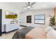 Well-lit bedroom features wood floors, TV, and neutral color palette for relaxation at 3204 Tradewinds Trl, Orlando, FL 32805
