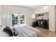 Comfortable bedroom with laundry area and direct access to outdoor space at 3204 Tradewinds Trl, Orlando, FL 32805