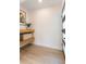 Bright entryway with a modern door, a floating shelf, and light wood flooring at 3204 Tradewinds Trl, Orlando, FL 32805