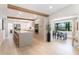 Open-concept kitchen with an island and an adjacent dining area featuring modern appliances and stylish design at 3204 Tradewinds Trl, Orlando, FL 32805