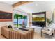 Bright living room with contemporary furnishings and a large window providing natural light and backyard views at 3204 Tradewinds Trl, Orlando, FL 32805