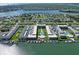 Scenic aerial view of waterfront condos with docks and a pool at 325 N Causeway # D104, New Smyrna Beach, FL 32169