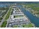 Waterfront condo community with boat docks and serene water views in aerial shot at 325 N Causeway # D104, New Smyrna Beach, FL 32169