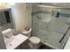 Cozy bathroom featuring a tiled walk-in shower and a vanity with a sink at 325 N Causeway # D104, New Smyrna Beach, FL 32169