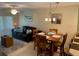 Cozy living room with neutral decor, comfortable seating, dining area, and natural light at 325 N Causeway # D104, New Smyrna Beach, FL 32169