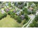 Enjoy this home's aerial view on a corner lot with mature trees and a well-manicured lawn at 341 Kirkhill St, Ocoee, FL 34761